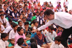 Enthusiastic students participating in a quiz competition at Karanjoti village, Thane, Mumbai